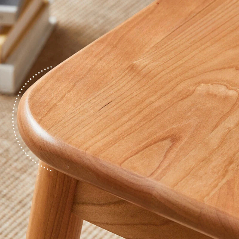 A Wooden Dining Room Chair Featuring a Smooth Curved Edge  