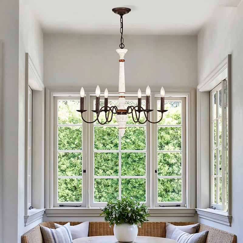 Dining room chandelier over a cozy relaxation spot