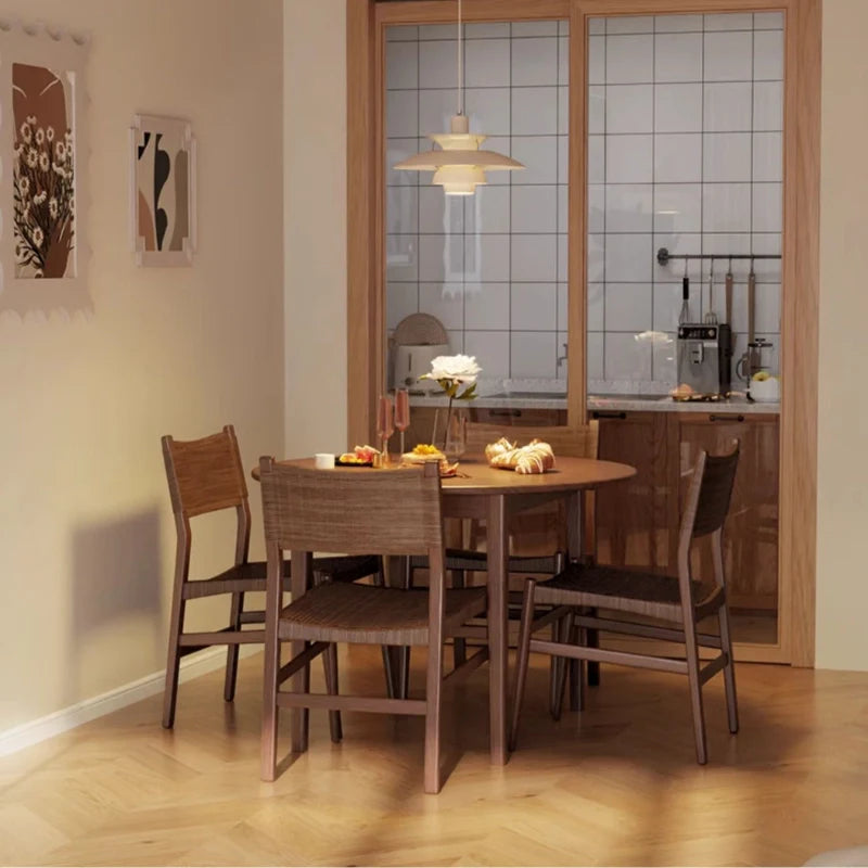 an extendable solid wood dining table with 4 wooden dining chairs