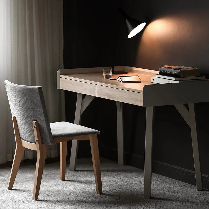 a wood desk with drawers and a matching chair 