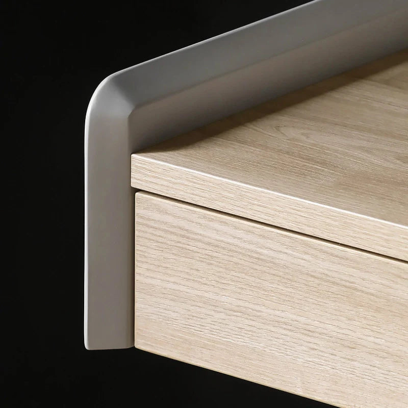 the curved edge of a solid wood desk