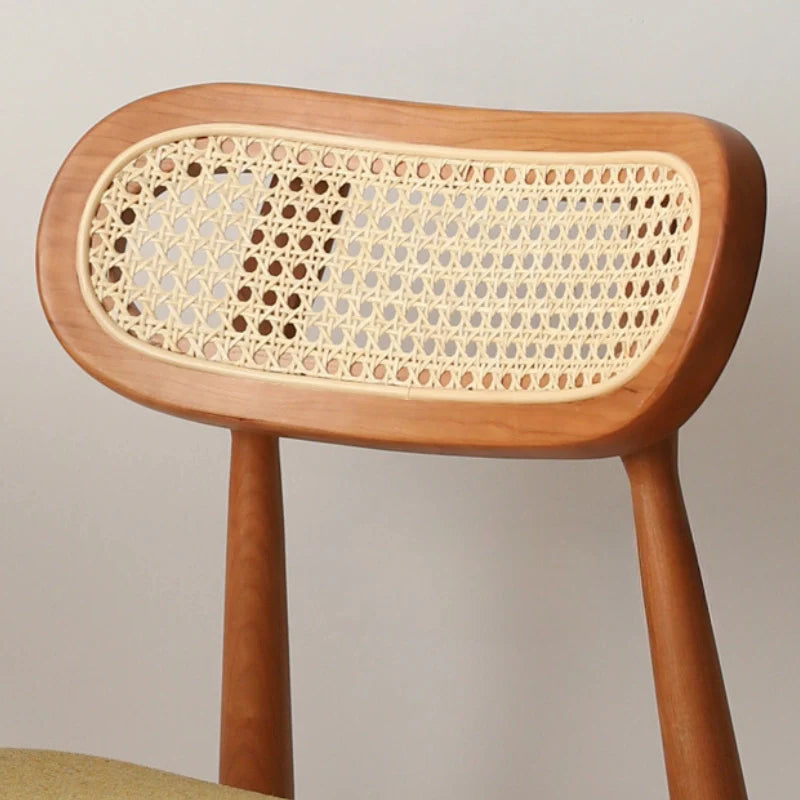 A Rattan Dining Chair featuring a Curved Backrest (Front View)