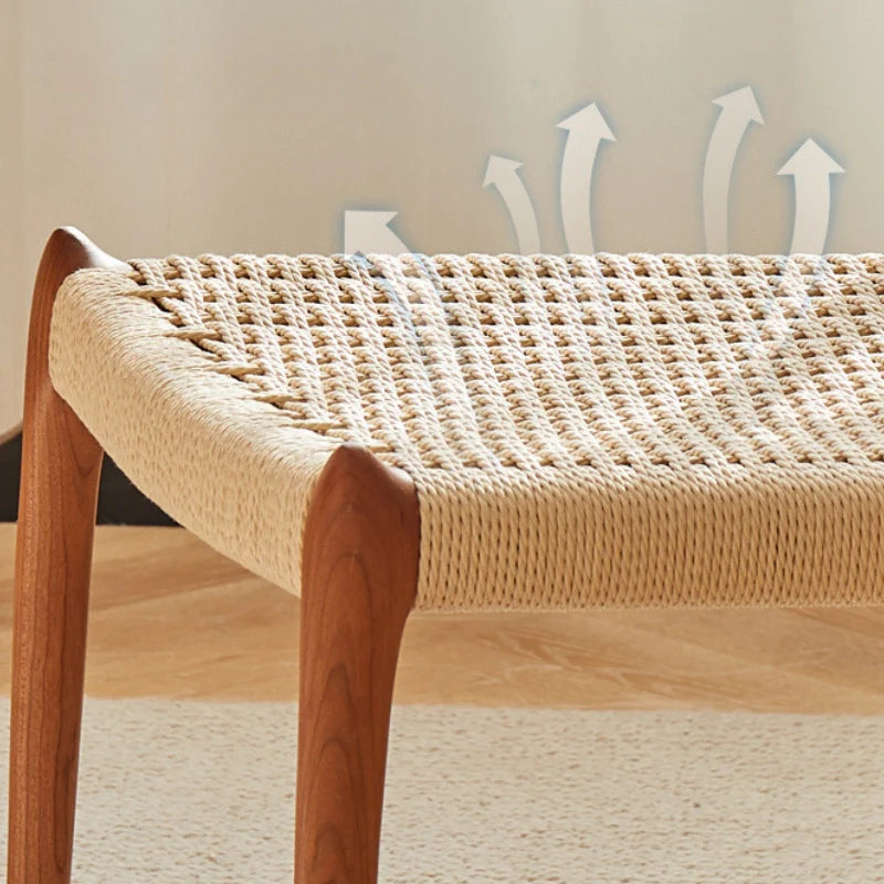 A Wooden Dining Room Chair Featuring a Woven Rope Seat  