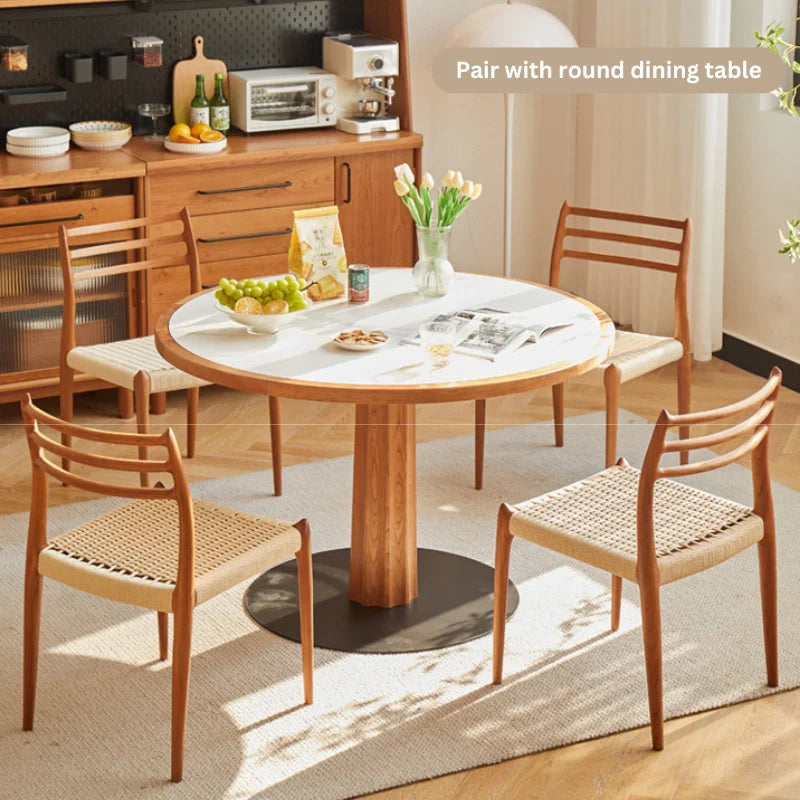 Wood Dining Chairs Placed Around a Round Wood Dining Table 