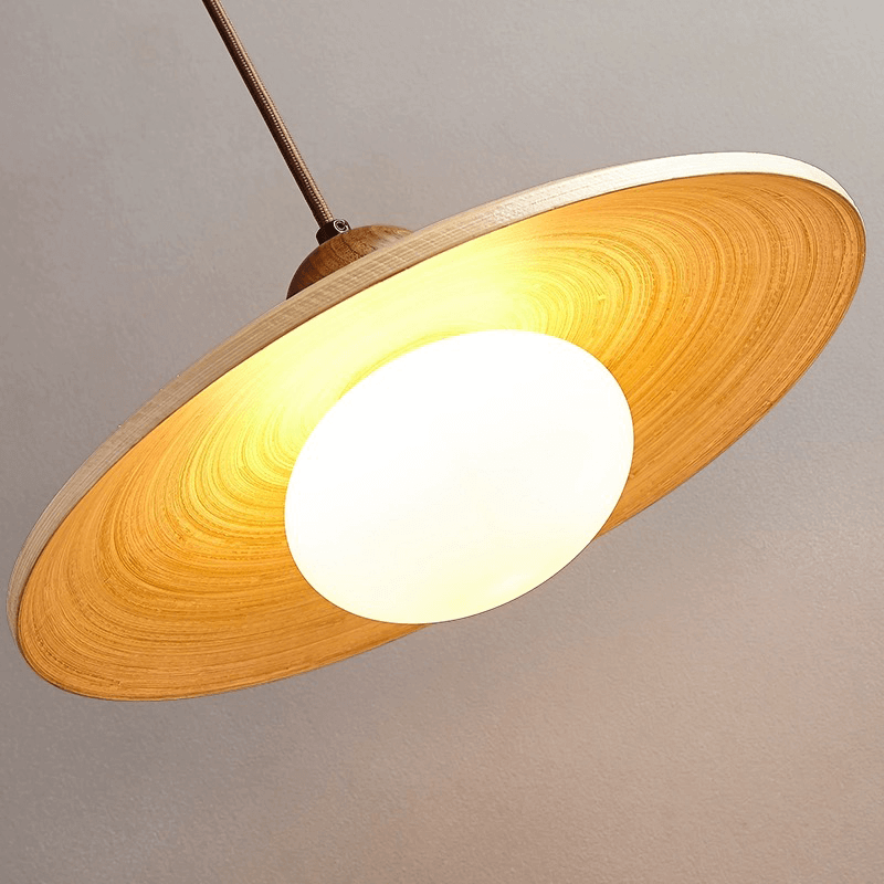 Image of kitchen pendant light highlighting its wooden lanpshade and bulb  