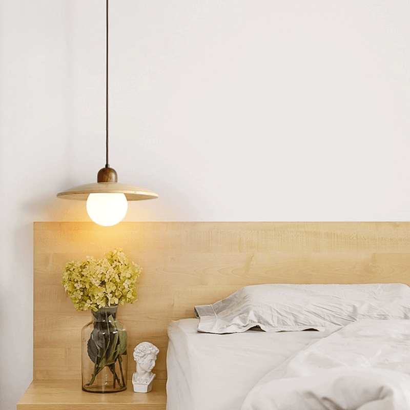 Kitchen pendant light by the bedside in a bedroom setting