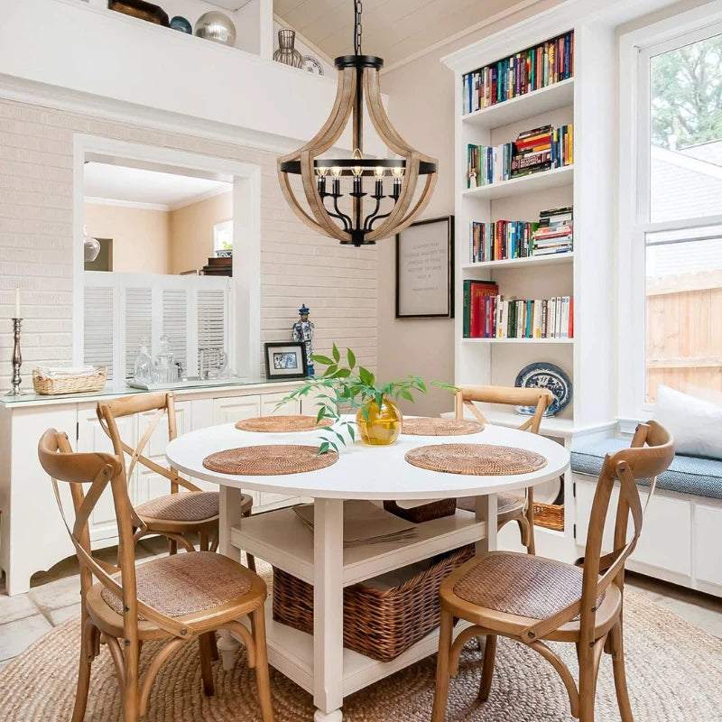 5-light Wood and Metal kitchen pendant light with candle lamp holders mounted above a dining table.