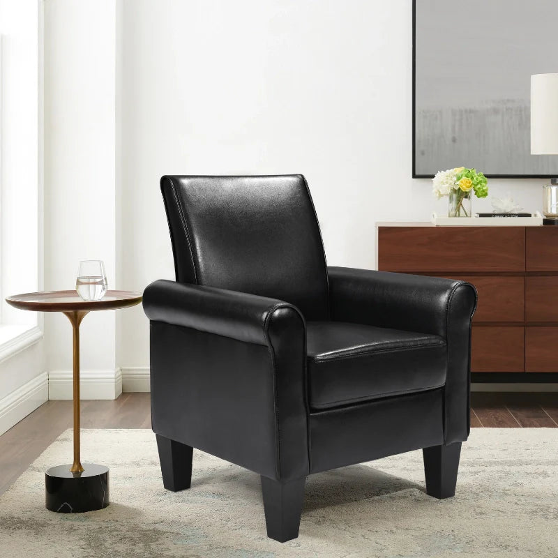 Black leather accent chair in a modern office corner