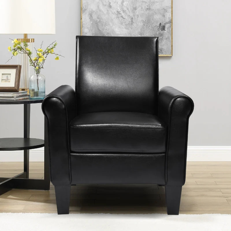 Black leather accent chair in a cozy office corner