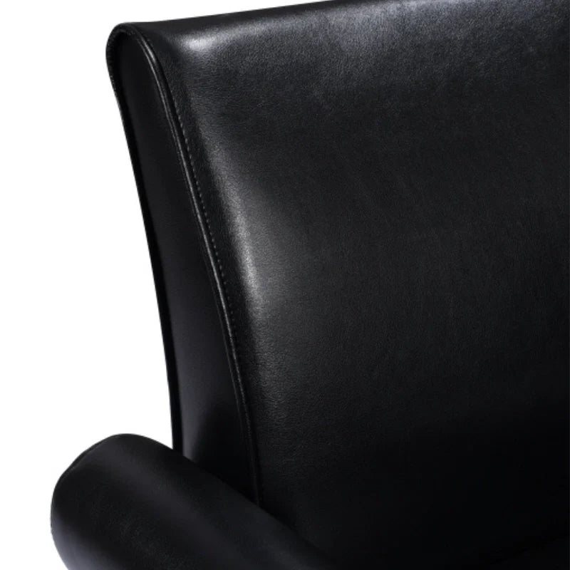 Close view of the black leather accent chair showing its PU leather upholstery and backrest