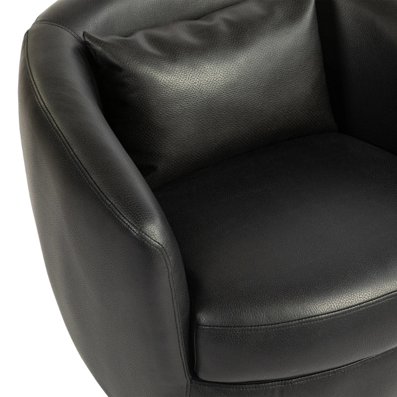 Up close view of black leather accent chair with swivel base showing plush cushioning 