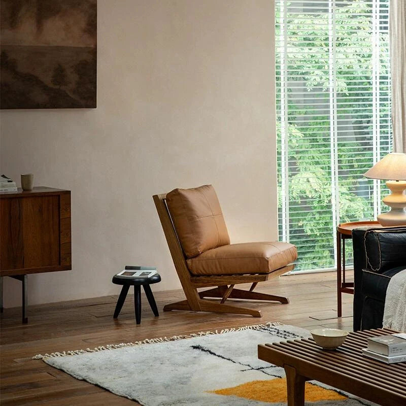 a brown leather accent chair in a modern setting