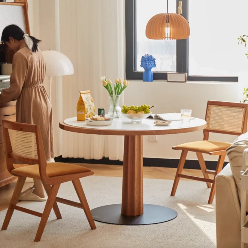 A Wood Pedestal Dining Table with Matching Wooden Dining Chairs