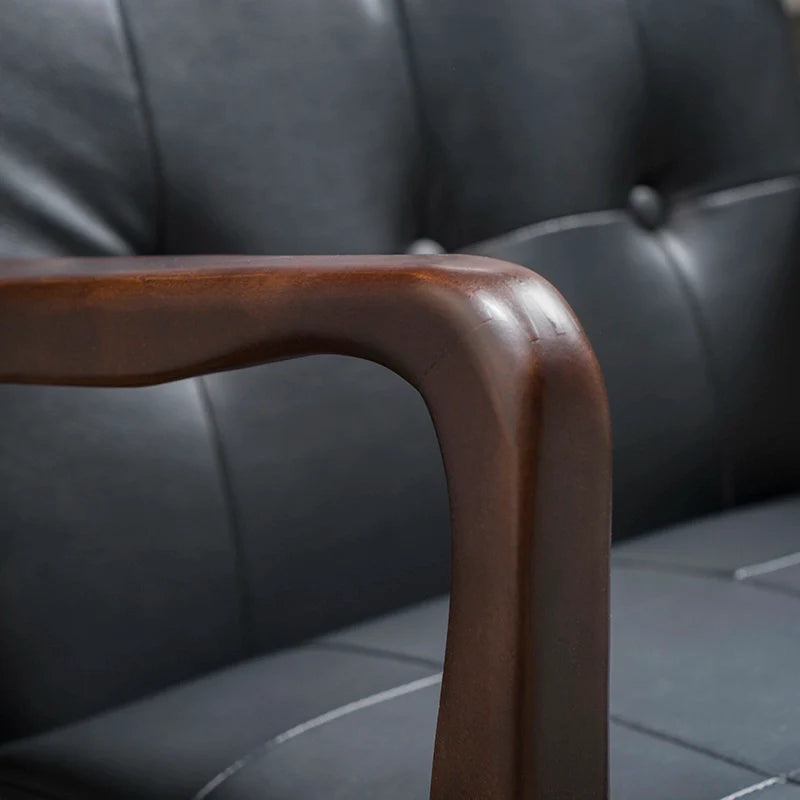 the armrest of a leather accent chair