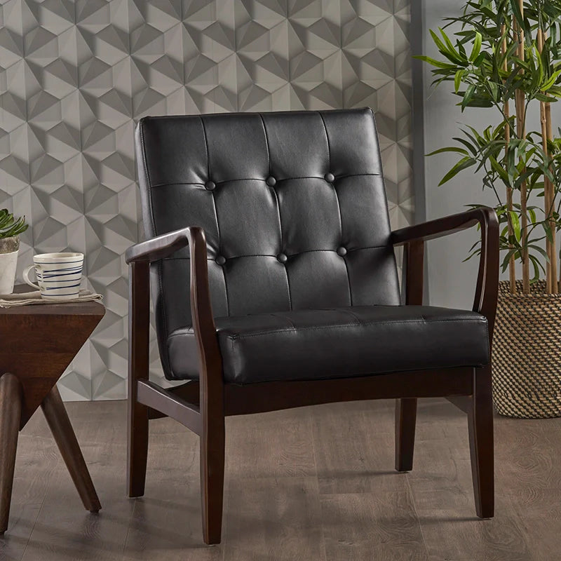 a black leather accent chair in a living area