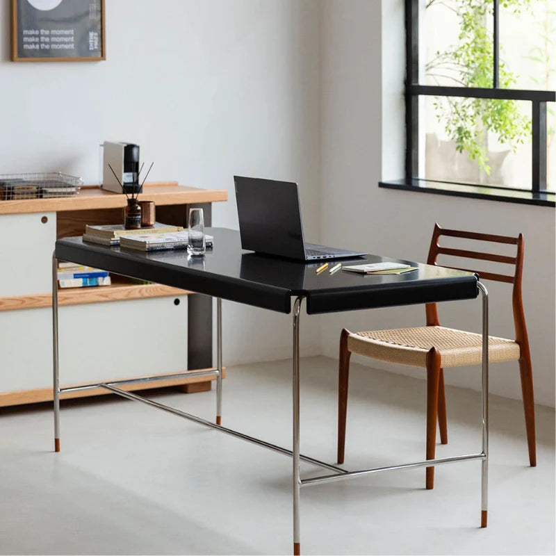 a wood and metal desk with stainless steel legs in black