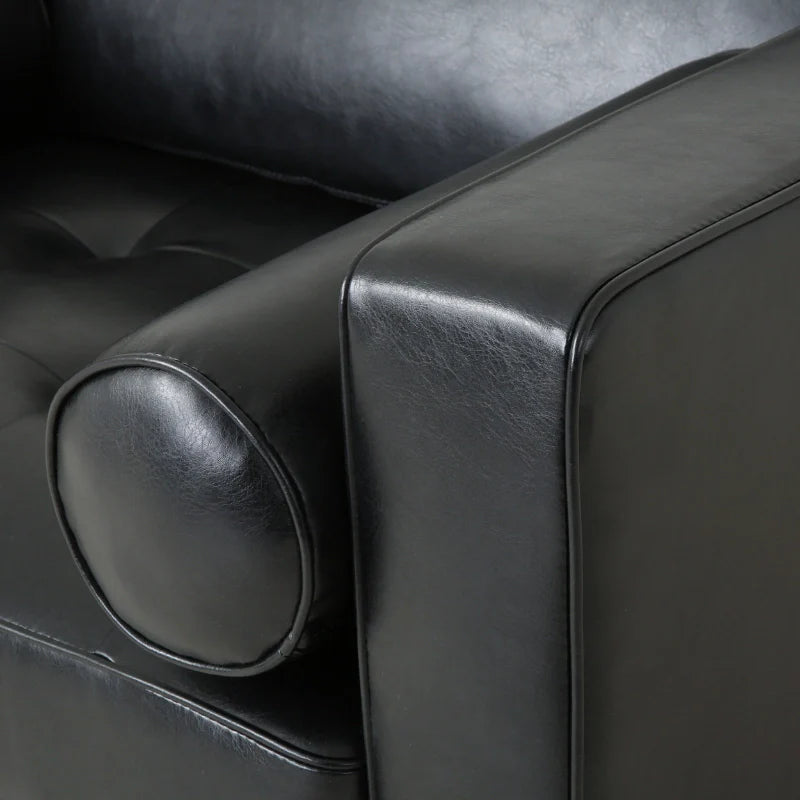 The armrest  of a black leather accent chair 