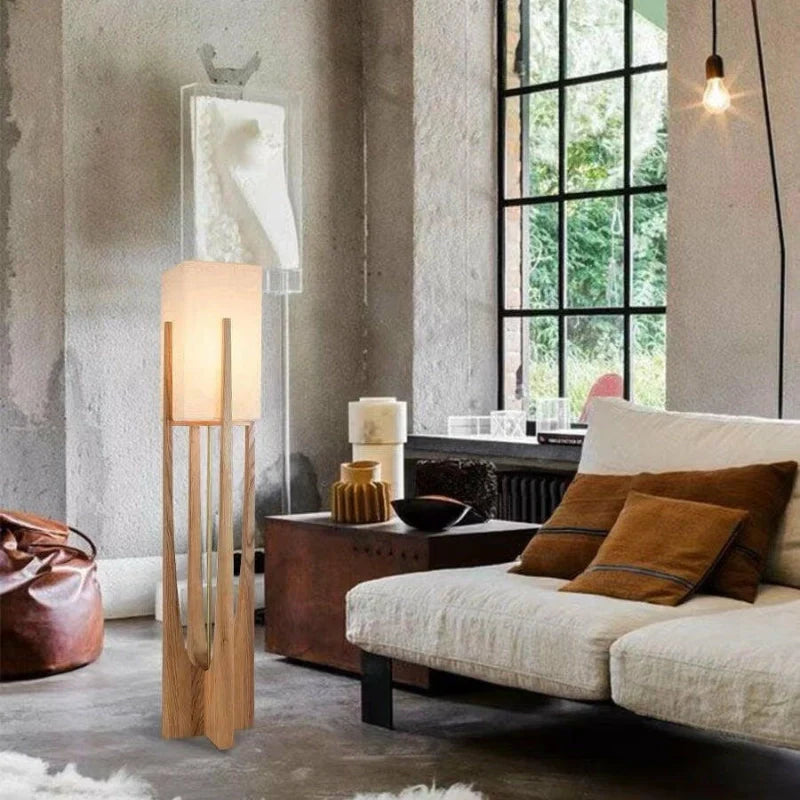 Mid Century Modern floor lamp in natural wood color illuminating a living room