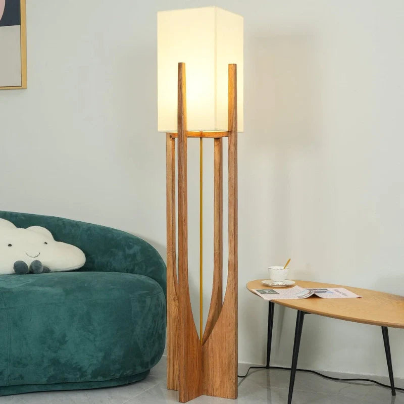 Mid Century Modern floor lamp illuminating a cozy reading nook and relaxation corner