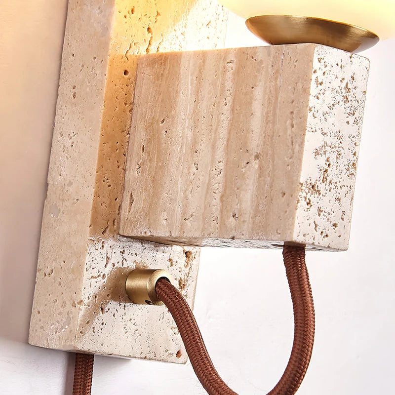 Up close view of travertine base of Plug in Wall Light 