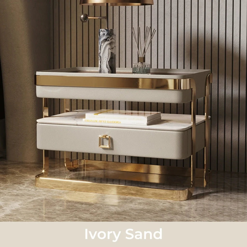 An image of modern nightstand with a sleek tempered glass top, PU leather drawer, gold metal frame, and open sintered stone shelf, showcasing a stylish and functional design perfect for bedside table ideas and contemporary bedroom aesthetics.