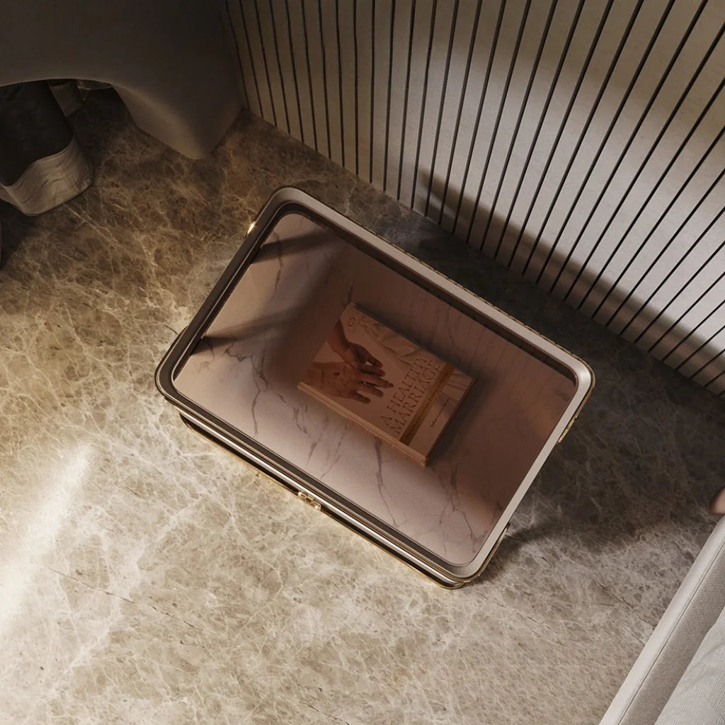 An image of modern nightstand with a sleek tempered glass top, PU leather drawer, gold metal frame, and open sintered stone shelf, showcasing a stylish and functional design perfect for bedside table ideas and contemporary bedroom aesthetics.