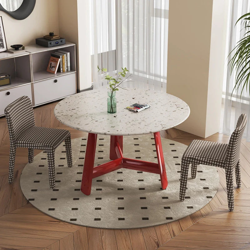 a round wood dining table with 2 dining chairs