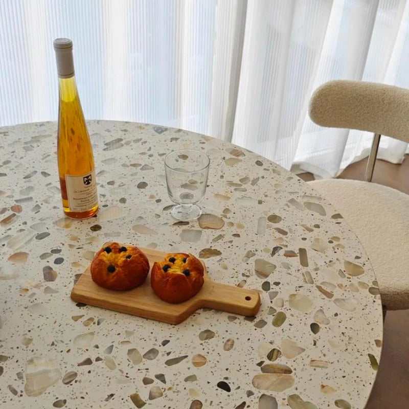 a solid wood dining room table with sintered stone top showcasing some eatables