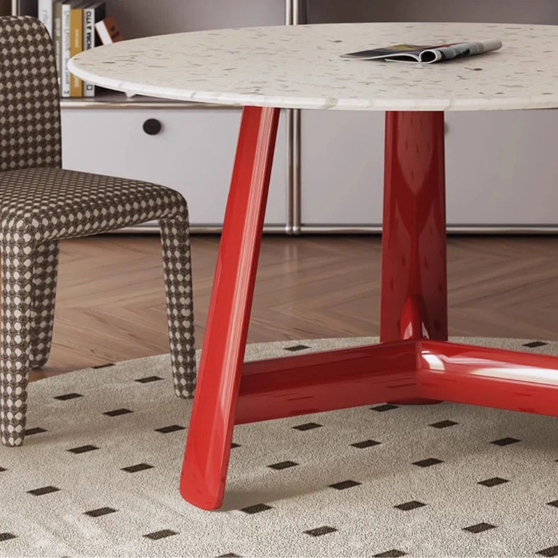 a round wood dining table for 4 with red base