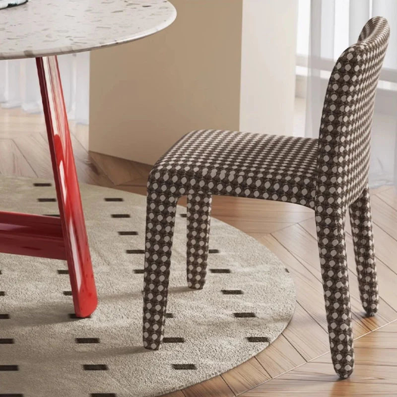 a round wooden dining room table with  a dining chair