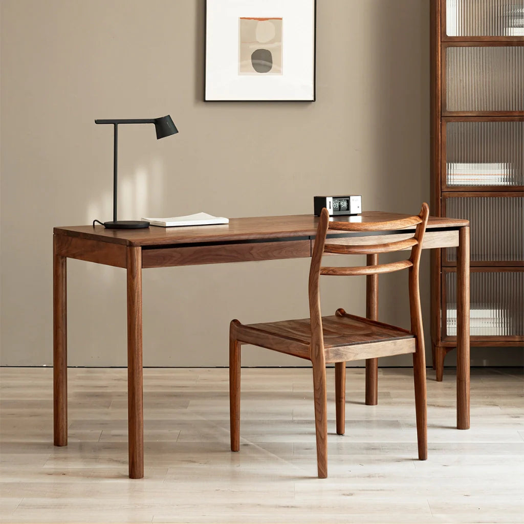 A sleek wood office desk with a minimalist design and built-in drawers for storage.