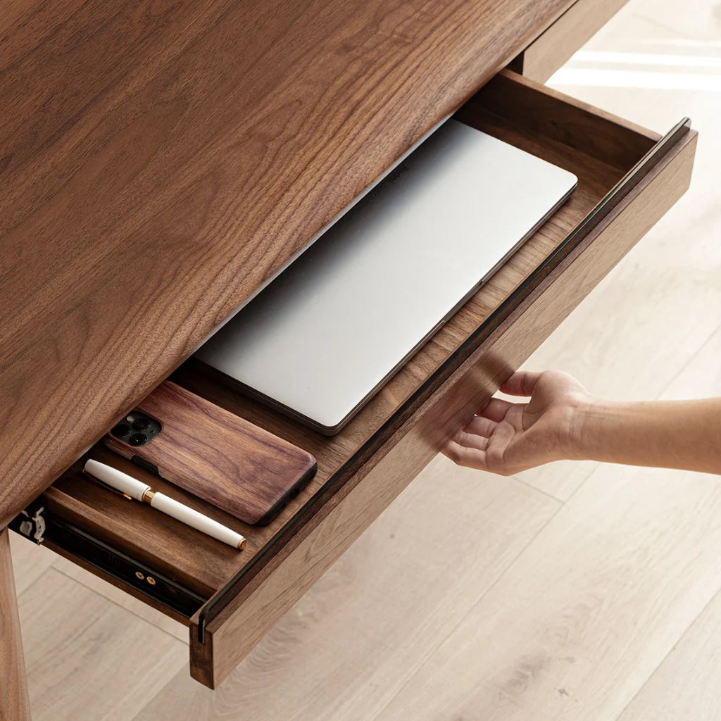 A durable solid wood desk with sleek walnut tones and hidden drawer storage.