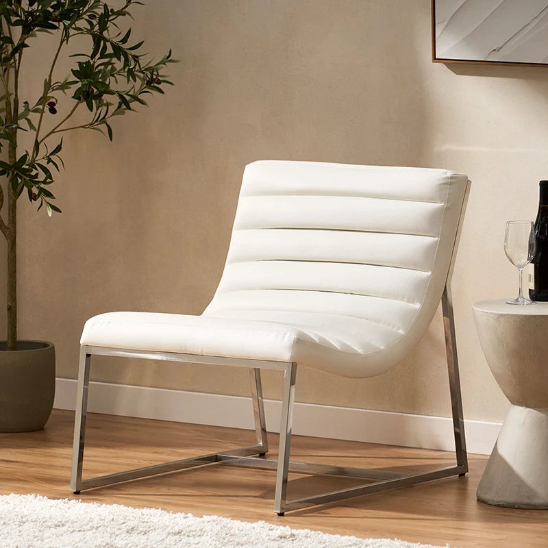 the side view of a white leather accent chair 