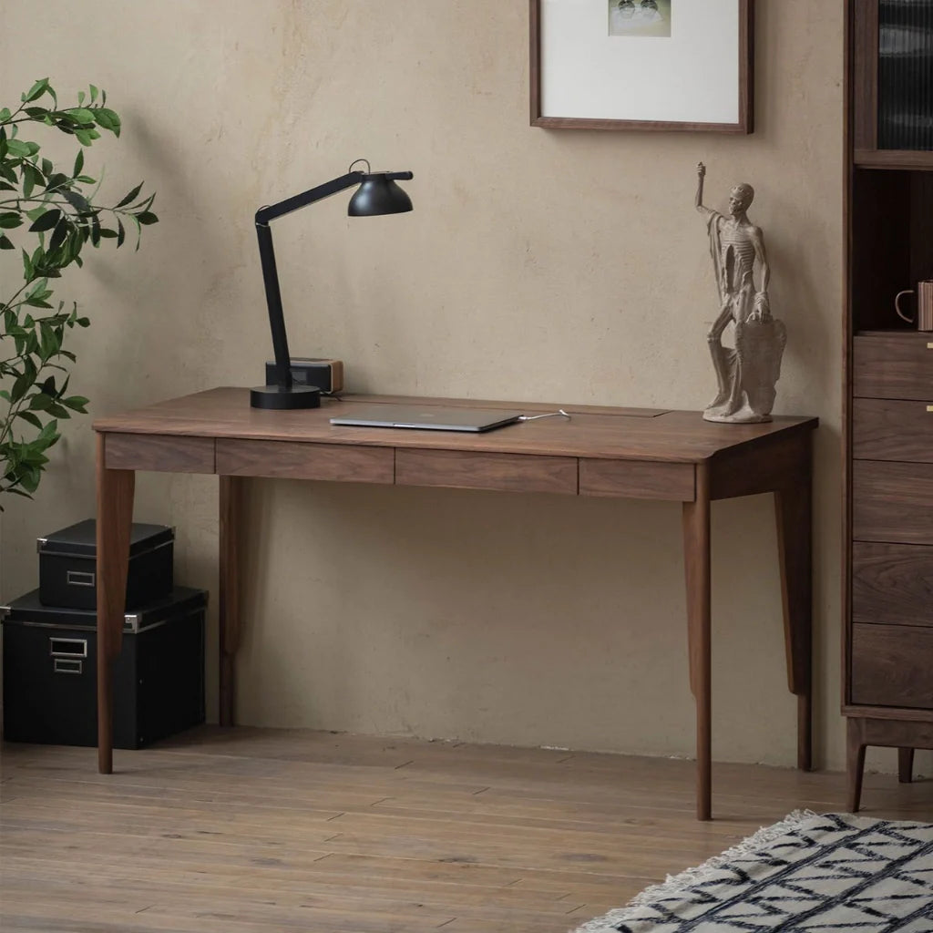 A sleek wooden writing desk made from solid walnut wood, featuring two spacious drawers and a cable management slot.