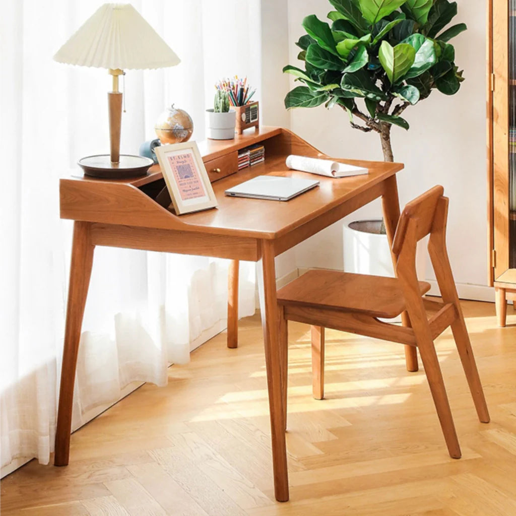 A compact cherry wood desk with clean lines, a drawer for essentials, and a small hutch for gadgets.