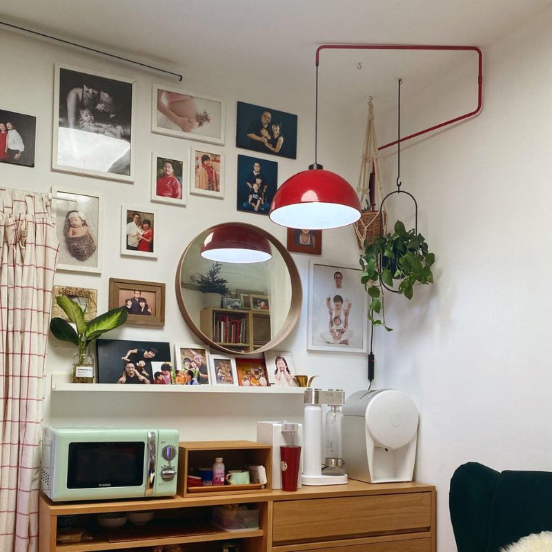 Red Plug in Wall Light with dome shade illuminating a cozy Living Space