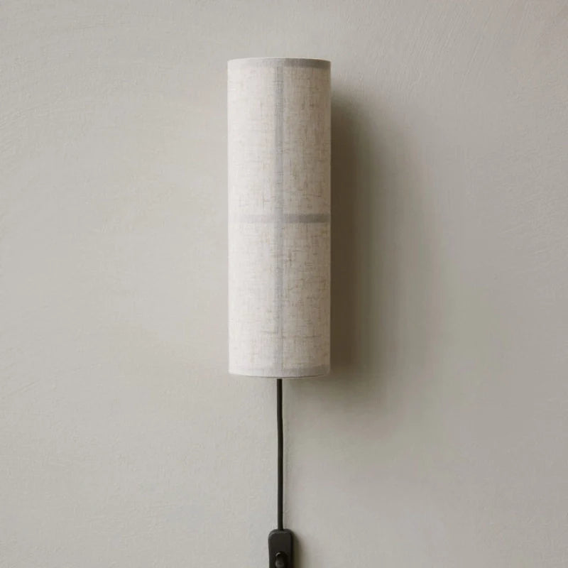 Cylinder fabric pug in wall sconce with white lambshade