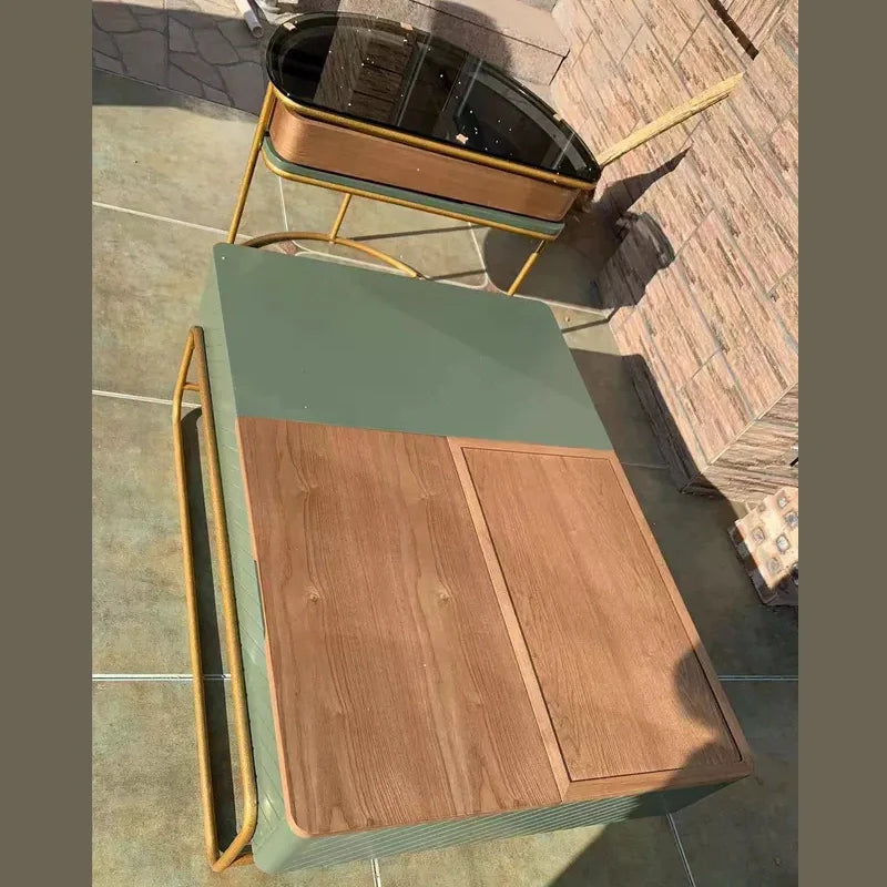 a green wood rectangle coffee table in an outdoor area