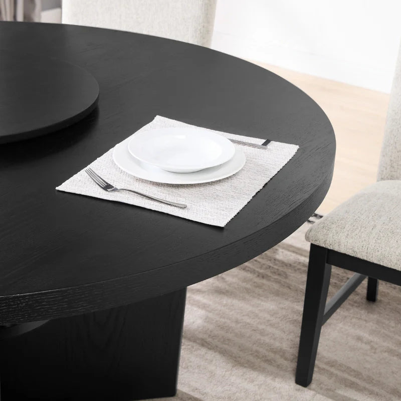 Sectional image of the black wood dining table, with serving dish on top