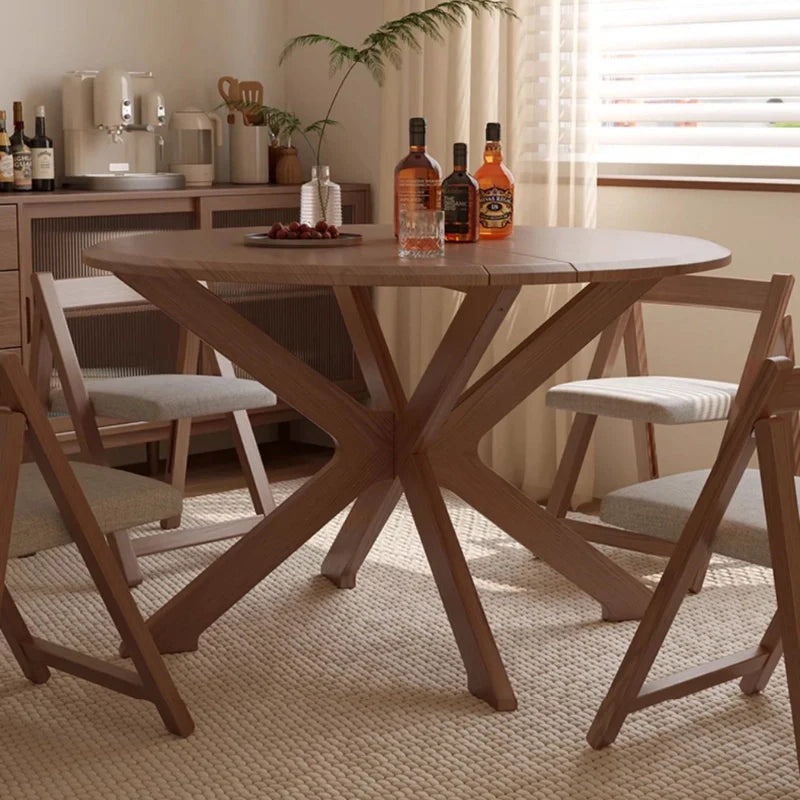 A Solid Wood Extendable Dining Table With x-shaped Legs