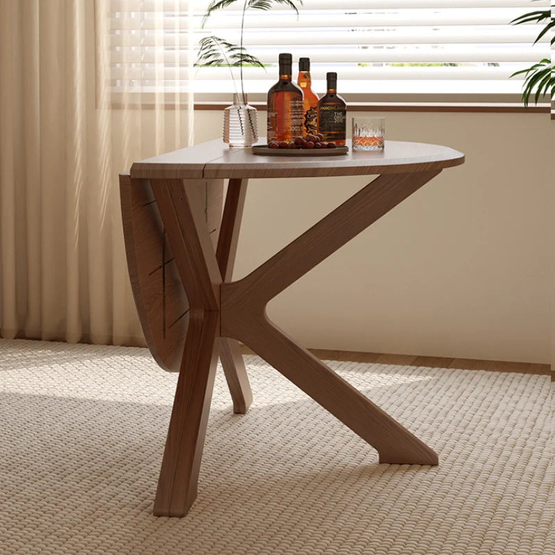 a wooden extendable dining table placed in a corner of the living room