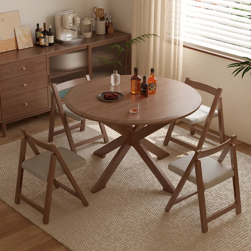 an extendable wooden dining table with matching dining chairs