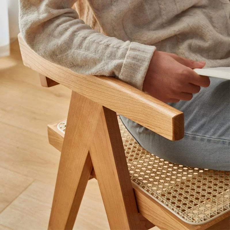 The Armrest of a Rattan Chair Dining, Comfortably Supporting the Arm.