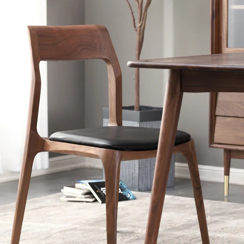 Wood and leather dining chair by a dining table 