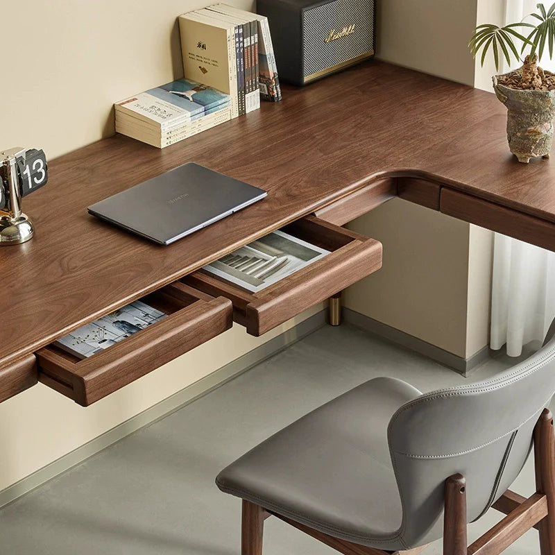 a solid wood l shaped desk with two opened drawers for ample storage