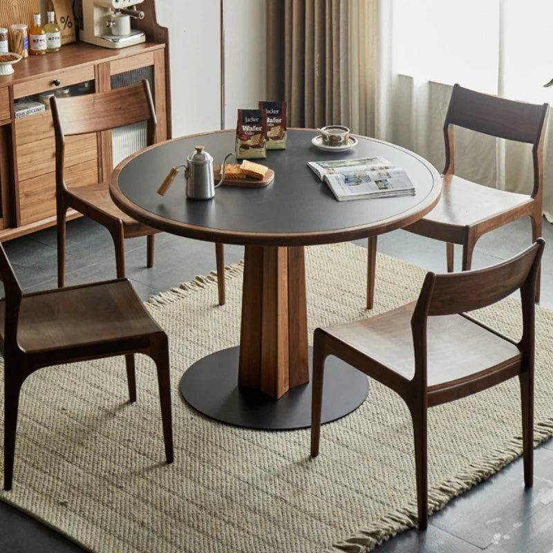 A Wood Pedestal Dining Table with Sintered Stone Top and Matching Dining Chairs