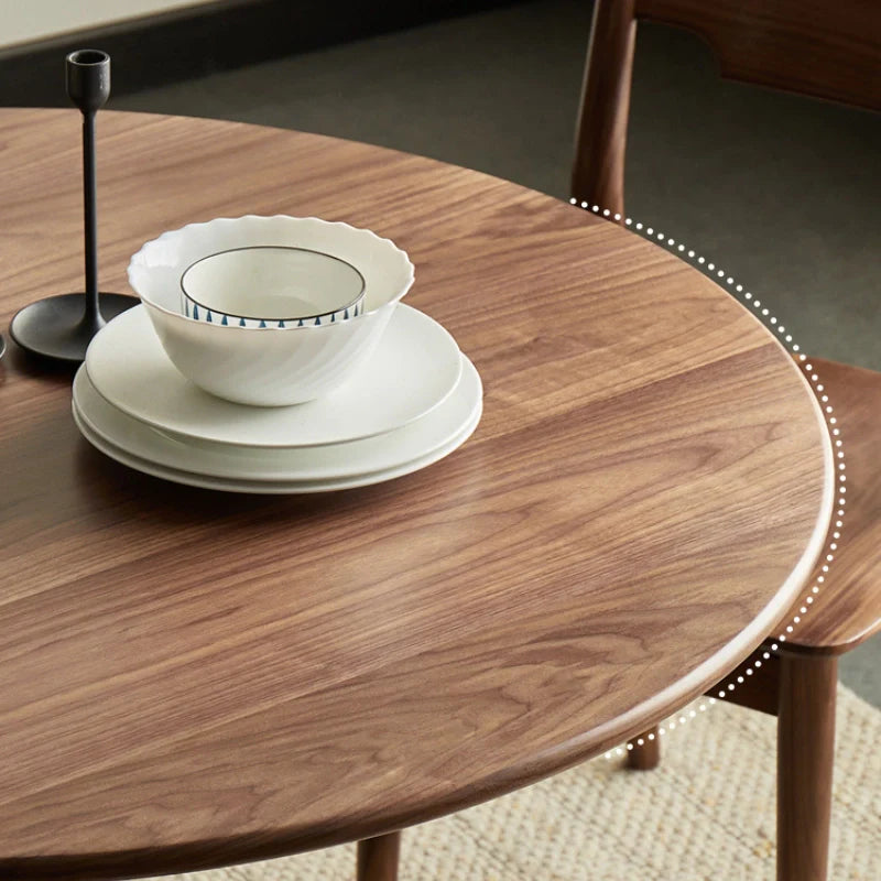 round wood pedestal dining table with a smooth edge