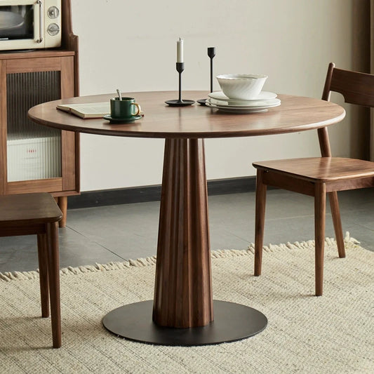 A Wood Pedestal Dining Table and Dining Chairs in a Modern Living Room