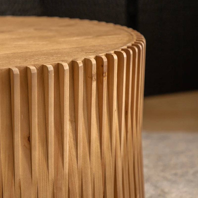 a wood round coffee table with vertical textured embossed design