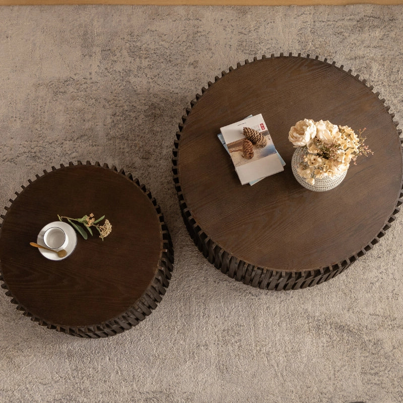 a close-up view of a solid wood round coffee table set of 2